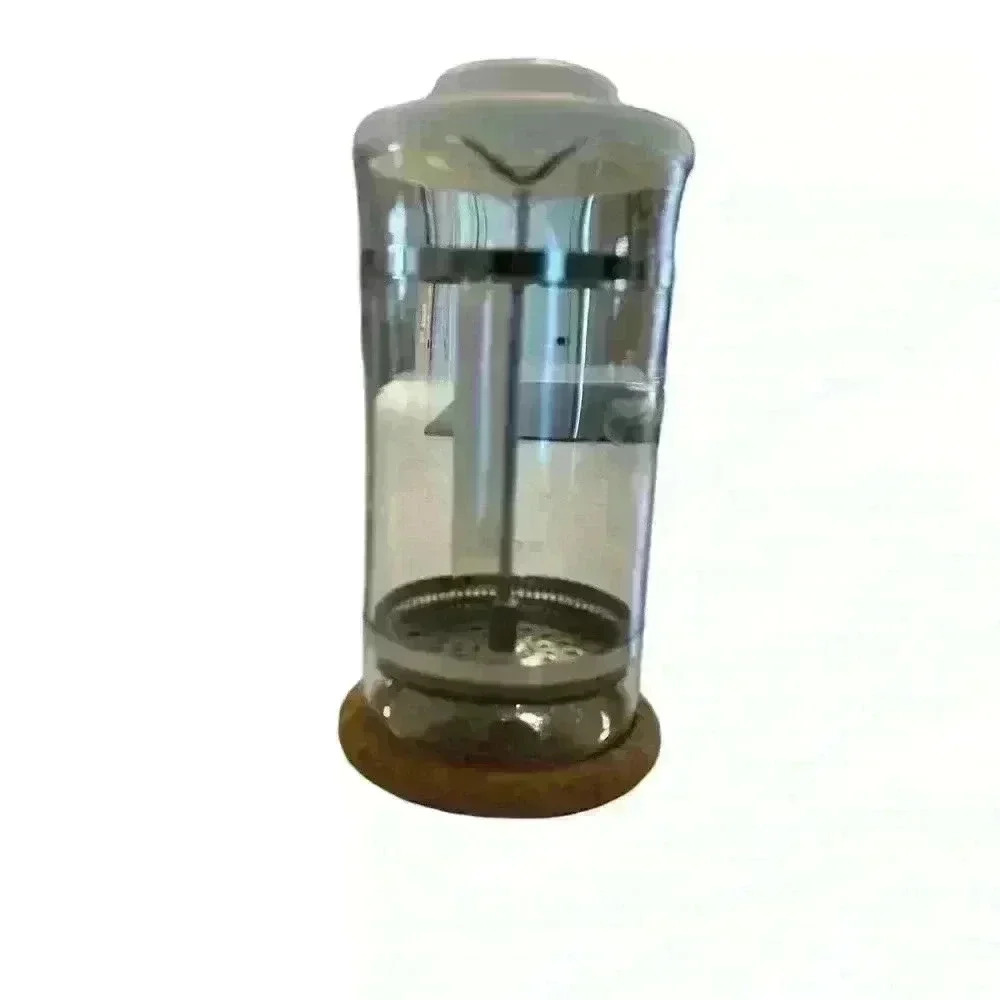 Vintage Bodum French press from the 80's with cork coaster